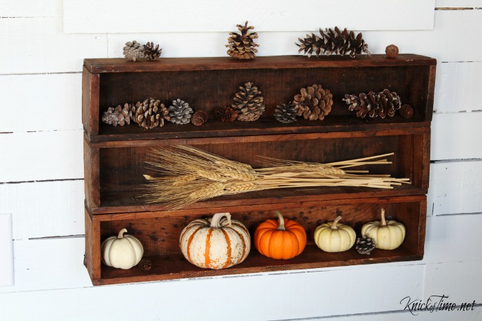 Fall decor with antique crates, pumpkins, pine cones and wheat - KnickofTime.net