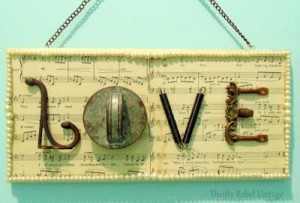LOVE sign created with salvaged junk and sheet music