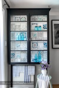 How to use stencils on a glass cabinet makeover - featured at www.knickoftime.net