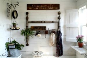 Farmhouse entryway with DIY salvaged headboard coat rack, wood window shutters and sign with Vintage Sign Stencils - www.KnickofTime.net
