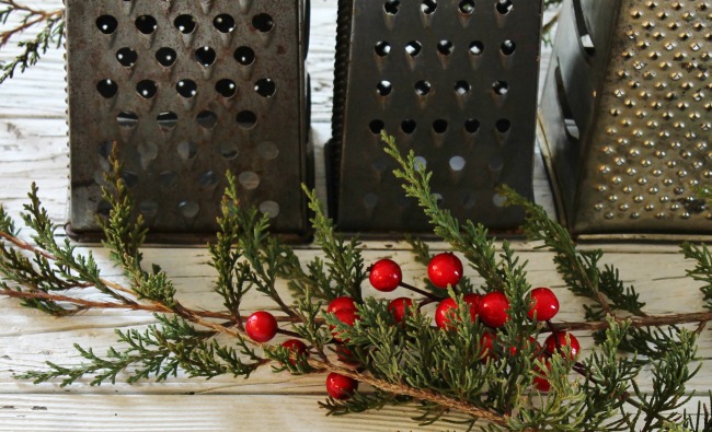 Create a simple Christmas candlelit centerpiece with repurposed vintage graters - www.knickoftime.net