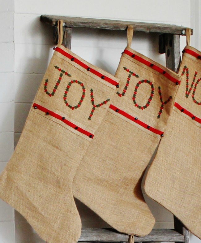 Turn an rustic old ladder into the perfect farmhouse Christmas stocking hanger! www.knickoftime.net