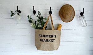 How to stencil on burlap to make a reusable grocery shopping tote bag with Knick of Time's Vintage Sign Stencils #knickoftime #vintagesignstencils # burlap #DIY